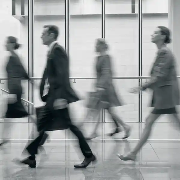 Business people moving through a modern workplace